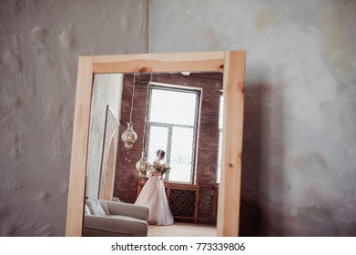 Bride In A Pink Dress. Morning. Waiting For The Groom. Reflection In The Mirror. Room In The Style Of Morocco.