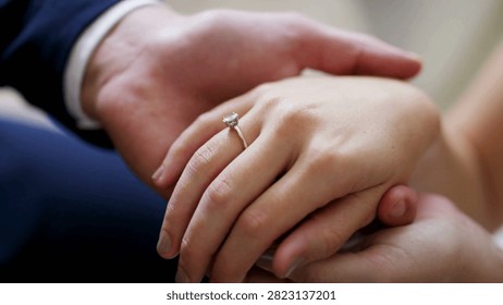 Bride placing the wedding ring on her groom during their wedding ceremony. closeup of bride and groom exchanging wedlock rings groom and bride 4K HD