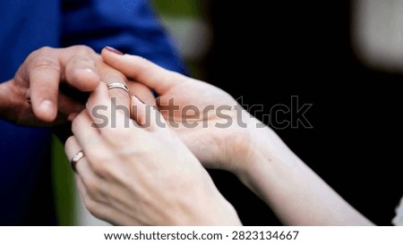 Bride placing the wedding ring on her groom during their wedding ceremony. closeup of bride and groom exchanging wedlock rings groom and bride 4K HD