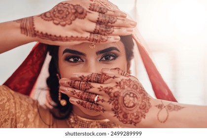 Bride, portrait and Indian woman with henna for marriage ceremony, vivaha or celebration. Accessories, culture and eyes of person with mehndi hands, sari or bridal jewelry for traditional wedding. - Powered by Shutterstock