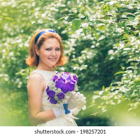 bride portrait in the park with bouquet