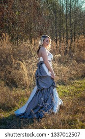 Bride posing in a field