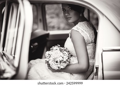 bride in a retro car