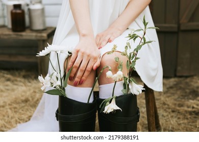 Bride In Short White Dress And Wreath  Having Fun At Barn Of Country House,  Flowers In Shoes The Concept Of Tenderness And Purity