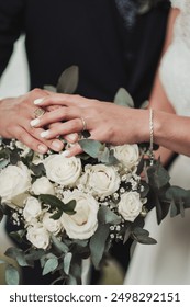 The bride is showing the ring 