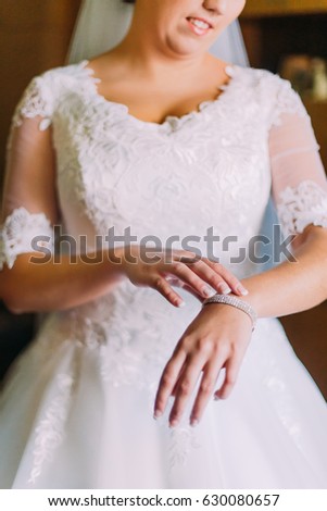 Bride shows beautiful expensive bracelet on her hand