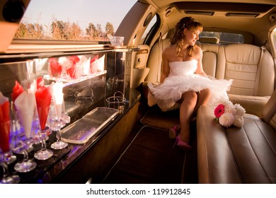 Bride Is Sitting In Limousine And Getting Ready To Get Out