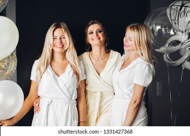 Bride Standing With Sad Bridesmaids And Showing Wedding Rind