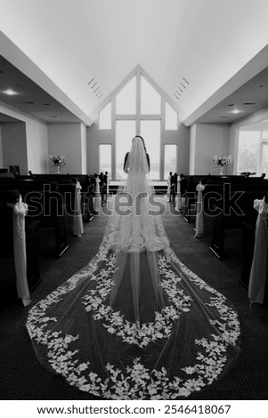 Image, Stock Photo bride in a long white dress with a wedding bouquet along with a groom in a stylish suit after a wedding ceremony in front wall with green ivy