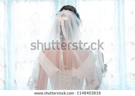 Similar – sad bride in wedding dress and long veil