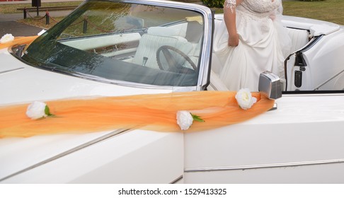 Bride Stepping Out Of The White Car