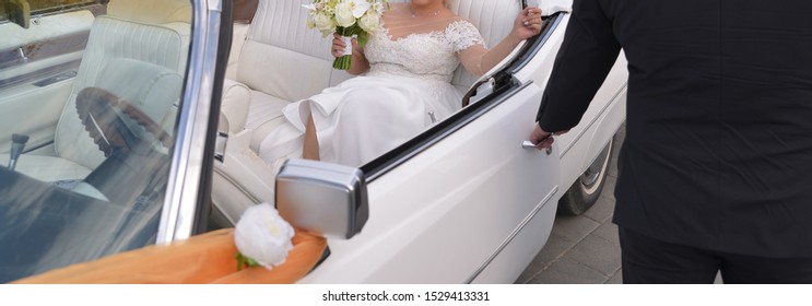 Bride Stepping Out Of The White Car