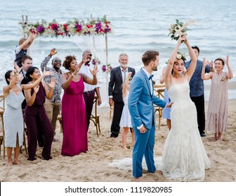 Bride throwing the bouquet at wedding - Powered by Shutterstock