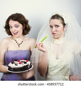 Bride Trying To Diet And Eating Celery Is Tempted By Bridesmaid Holding Up Cake. Square Banner Size.