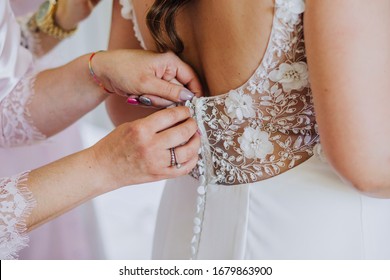 Bride Trying On The Wedding Dress