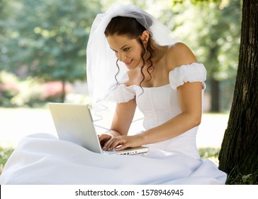 A bride using a laptop