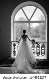 The Bride Is Waiting Before The Wedding Ceremony. Black And White Photo With The Effect Of Film Grain.