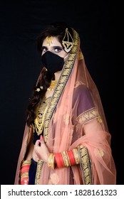 Bride Wearing White Indian Traditional Cloth With Face Mask With Black Background During Wedding Celebration In India