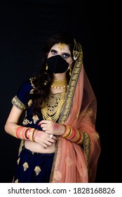 Bride Wearing White Indian Traditional Cloth With Face Mask During Wedding Celebration In India