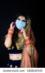 Bride Wearing White Indian Traditional Cloth With Face Mask During Wedding Celebration In India