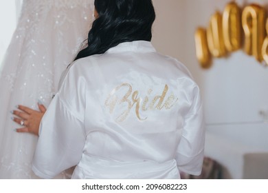 The Bride Wearing A White Robe And Getting Prepared For The Wedding In The Morning