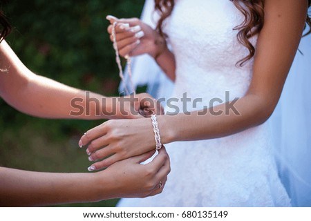 The bride wears a bracelet.