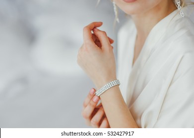 the bride wears a bracelet on hand