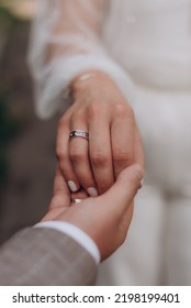 The bride wears a wedding ring to the groom at the wedding ceremony.
Hand in hand. Wedding, holiday, engagement. - Shutterstock ID 2198199401