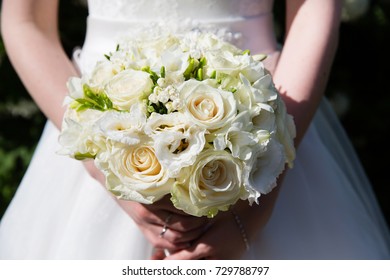 Bride with wedding bouquet, closeup