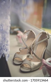 Bride wedding ceremony shoes standing near wall