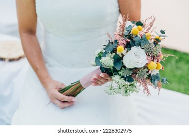 bride in wedding dress with bouquet - Shutterstock ID 2226302975