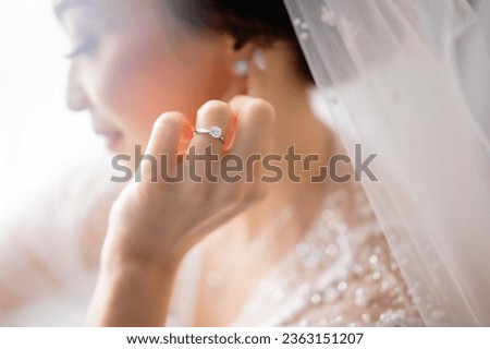 Bride in wedding dress with flawless complexion and serene expression.