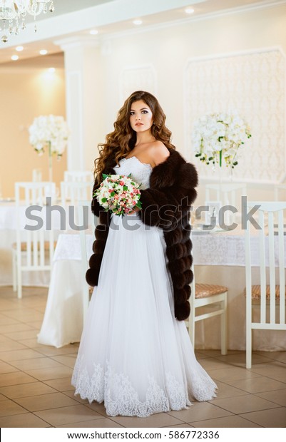 wedding dress with fur jacket