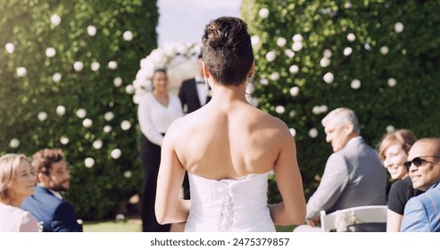 Bride, wedding and walking by aisle with marriage, commitment and love for groom or partner. Woman, ceremony and processional entrance for matrimony, loyalty and union outdoor with audience or crowd - Powered by Shutterstock