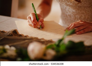 Bride Writing Vows For Wedding Close Up