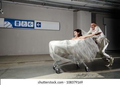 Bridegroom Very Fast Carry Fiancee In Shopping Trolley, Humour Photo