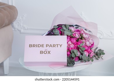 Bride's Box For A Bachelorette Party On The Background Of A Bouquet Of Flowers.
