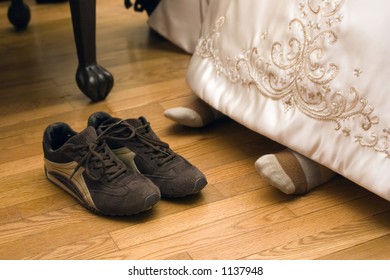 Bride's Feet With Tennis Shoes