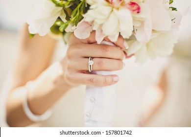 Bride's hands with flowers