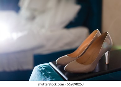 Bride's shoes and dress - Shutterstock ID 662898268