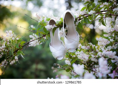 Bride's shoes on a log