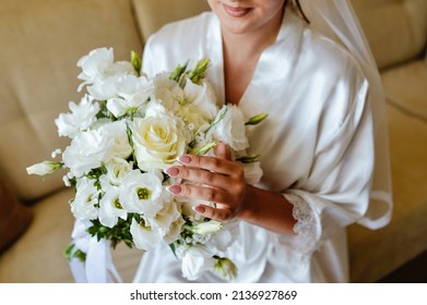 Bride's Wedding Bands In The Palm Of His Hand