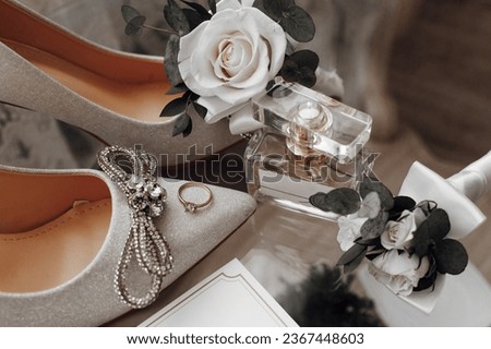 The bride's wedding ring is on the shoes, Perfume. Wedding details