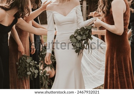 Bridesmaids Help Bride Get Ready