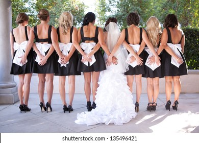 Bridesmaids holding each other