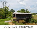 Bridge # 17-35-05

Located in Fleming County, the bridge was built in the 1860s, spanning Fox Creek just north of Grange City. The Burr arch truss structure was inundated by floodwaters in May 2020.