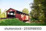 Bridge # 38-41-03.

Frazier Covered Bridge in Lycoming County, Pennsylvania, USA. The Burr Arch Truss bridge over Little Muncy Creek as built in 1888.