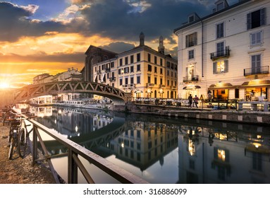 Bridge across the Naviglio Grande canal at the evening in Milan, Italy