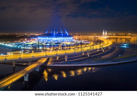 The bridge across the strait. The Gulf of Finland. Saint Petersburg. Highway in the evening. Evening city. Russia. The road leading to the island. Krestovsky Island in St. Petersburg.