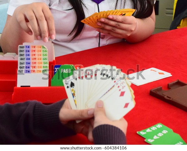 
Bridge card game with hand pick card from bidding
box